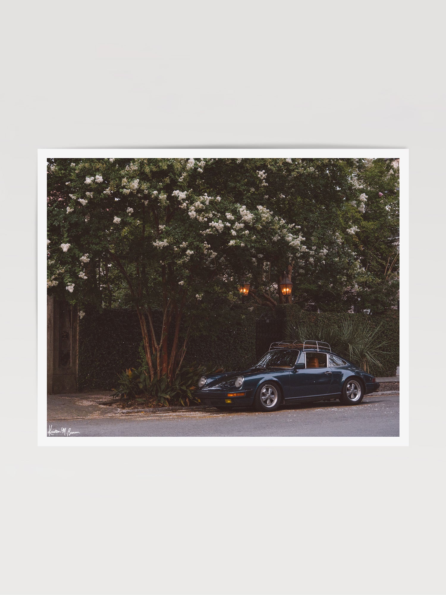 Tucked beneath the cascading white blooms of a towering crepe myrtle, this vintage Porsche 911 awaits its next adventure. So what are you waiting for? Hop on in and channel that carefree feeling of adventure and speed with this air cooled vintage beauty, "911 Meeting". Vintage Porsche 911 photo print by Kristen M. Brown of Samba to the Sea for The Sunset Shop.