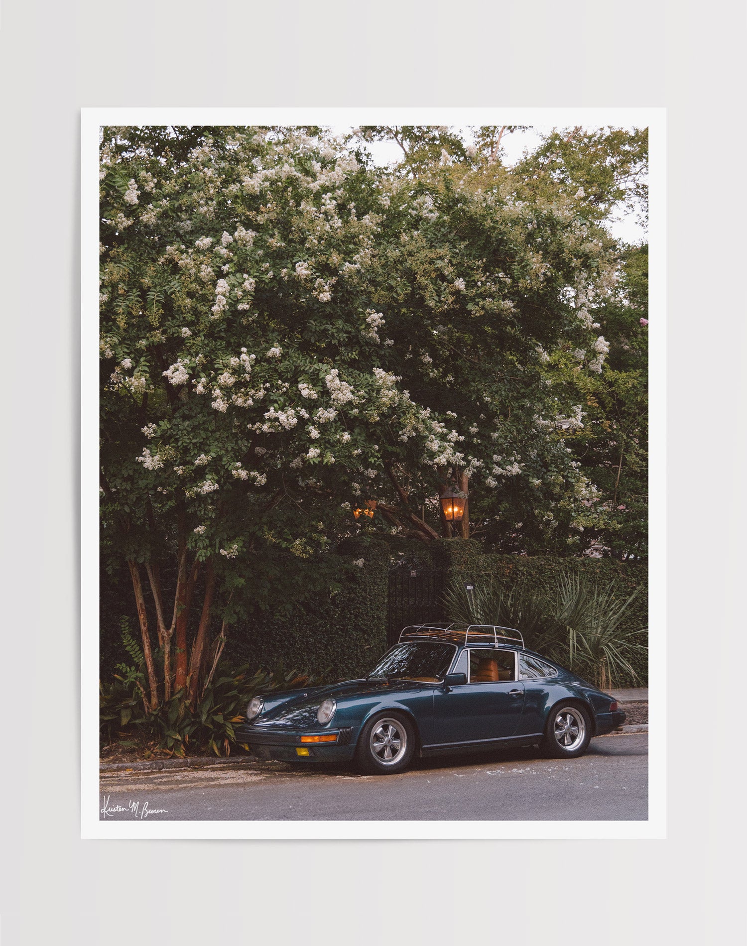 Tucked beneath the cascading white blooms of a towering crepe myrtle, this vintage Porsche 911 awaits its next adventure. So what are you waiting for? Hop on in and channel that carefree feeling of adventure and speed with this air cooled vintage beauty, "911 Meeting". Vintage Porsche 911 photo print by Kristen M. Brown of Samba to the Sea for The Sunset Shop.