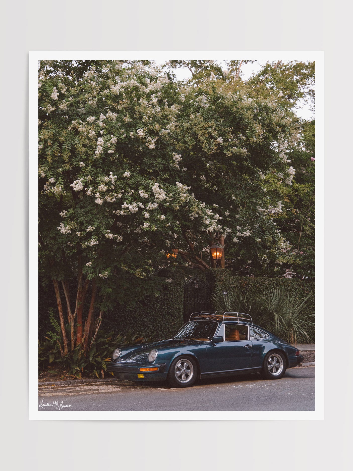 Tucked beneath the cascading white blooms of a towering crepe myrtle, this vintage Porsche 911 awaits its next adventure. So what are you waiting for? Hop on in and channel that carefree feeling of adventure and speed with this air cooled vintage beauty, "911 Meeting". Vintage Porsche 911 photo print by Kristen M. Brown of Samba to the Sea for The Sunset Shop.
