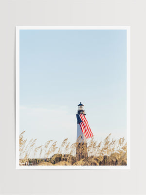 There she was, dancing in the sea breeze with the sea grass and shimmering in the late afternoon sun! Majestic American flag hanging from the Tybee Island Lighthouse in Tybee Island, GA. "Amber Waves" photographed by Kristen M. Brown, Samba to the Sea for The Sunset Shop.