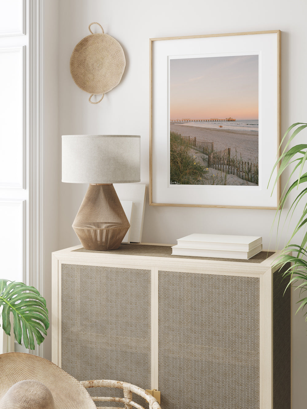 Framed photography of surfer walking out ocean at sunset in Charleston at Folly Beach pier hanging in coastal living decor living room. "Apres Suf" photographed by Kristen M. Brown, Samba to the Sea.