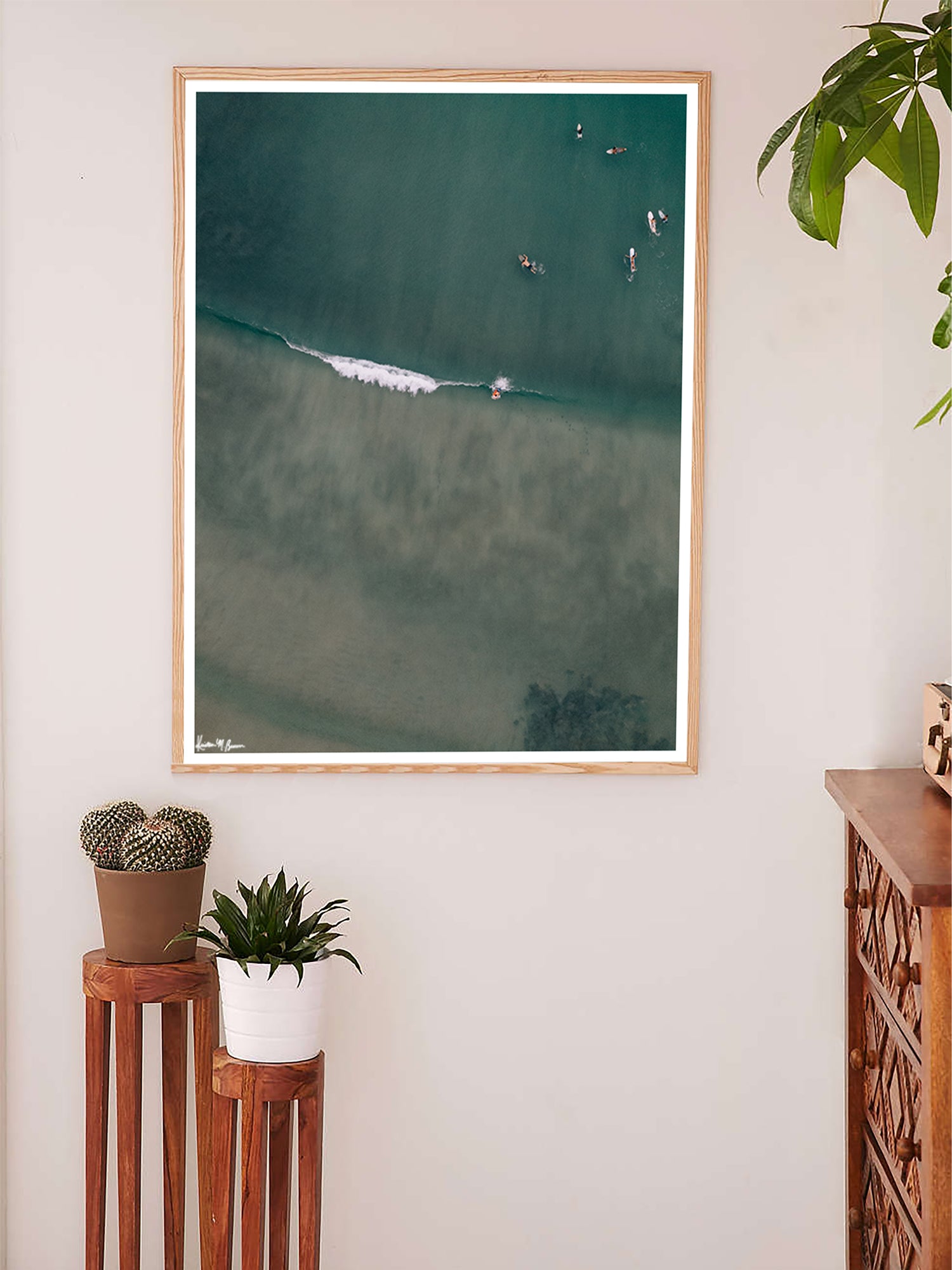 Living room wall art aerial surfer wave print by Samba to the Sea at The Sunset Shop. Image is an aerial photo of surfer dropping in on a wave in Playa Avellanas, Costa Rica.