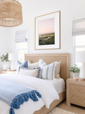 "Chatham en Rose" fine art photo print of a pastel sunrise in Cape Cod hanging over bed in a beautiful coastal bedroom. Pastel sunrise glow over the dunes at Lighthouse Beach in Chatham, Cape Cod.  Photographed by Kristen M. Brown of Samba to the Sea for The Sunset Shop.