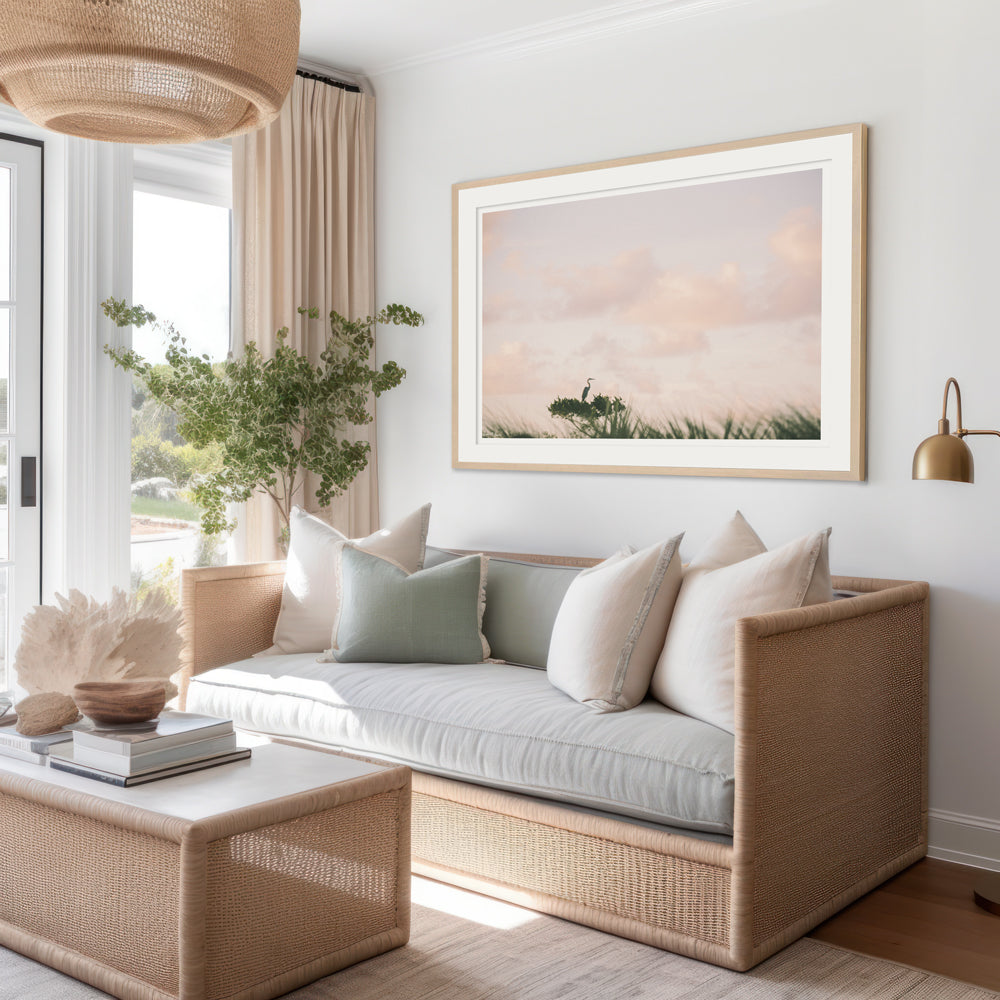 Framed photography of Egret perched on ocean swept tree during a pastel pink sunrise sky in Kiawah, Charleston SC. Hung in coastal living room. "Egret en Rose" photographed by Kristen M. Brown, Samba to the Sea.