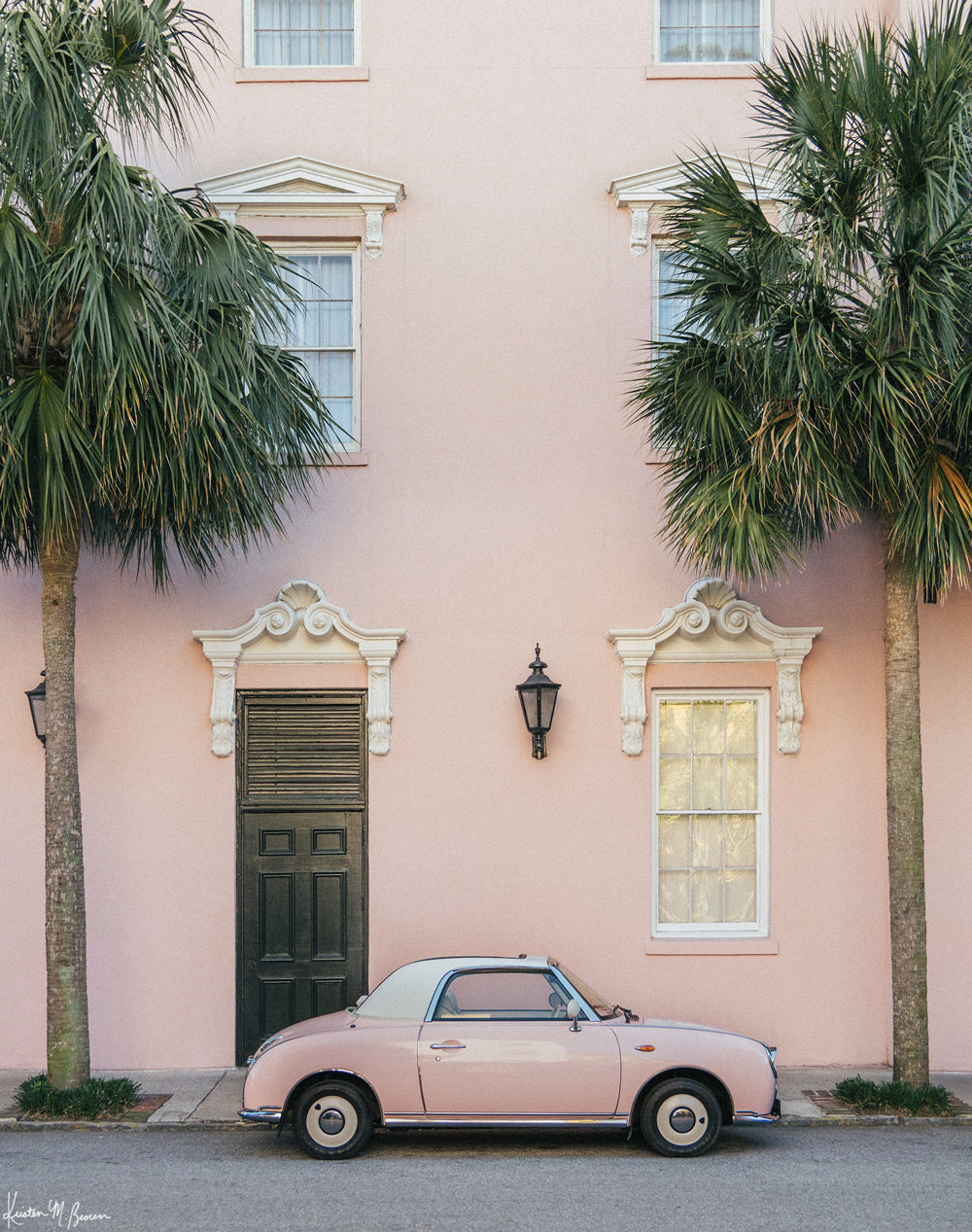 Photography of a pastel pink Figaro perfectly parked with a pink historic building in Charleston. "In the Pink" photographed by Kristen M. Brown, Samba to the Sea.