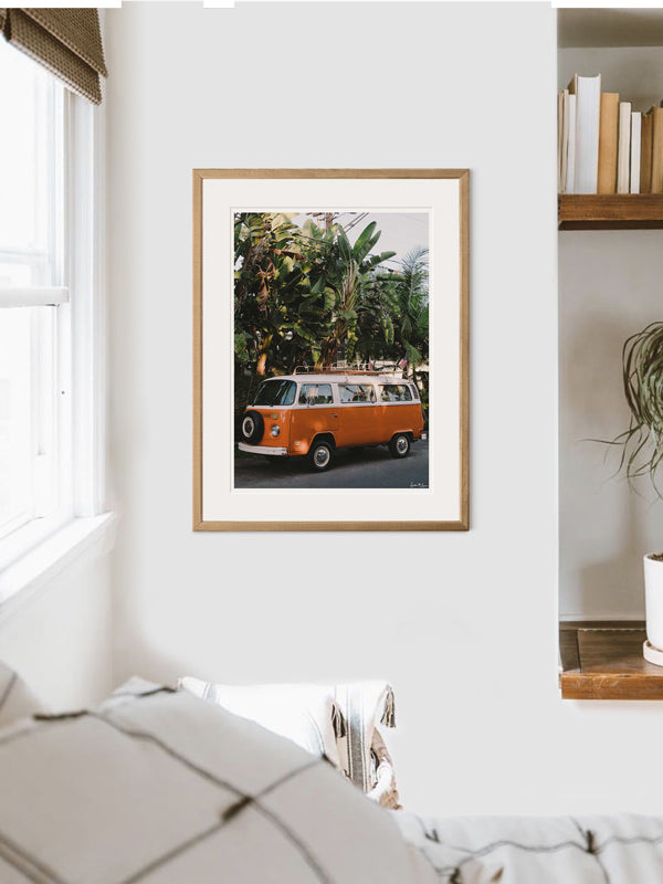 VW Bus photography print hanging in bedroom. Orange VW Bus photo print in Southern California. “Leucadia Bus” photo print of a beautiful vintage VW Bus in Encinitas, California by Kristen M. Brown of Samba to the Sea for The Sunset Shop.