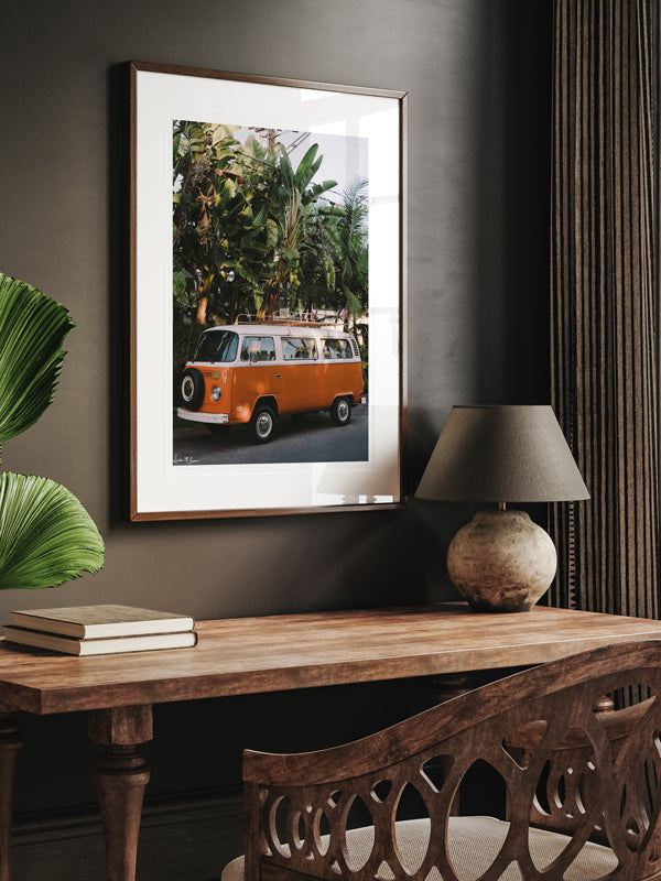 VW Bus photography print hanging in home office. Orange VW Bus photo print in Southern California. “Leucadia Bus” photo print of a beautiful vintage VW Bus in Encinitas, California by Kristen M. Brown of Samba to the Sea for The Sunset Shop.
