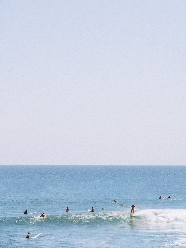 Surfer girl hanging five in Malibu, California. "Malibu Hanging" surfer photo print by Kristen M. Brown of Samba to the Sea for The Sunset Shop.
