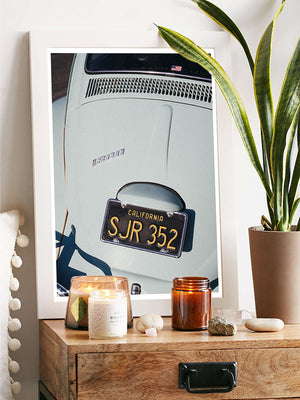 "Seaside Bug" photo print of classic VW Bug 1300 in the dreamiest shade of seaside turquoise. Photographed by Kristen M. Brown of Samba to the Sea for The Sunset Shop. Vintage VW Bug photo print in modern coastal living room.