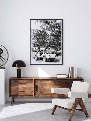 Midcentury modern living room with black & White vintage white CJ parked under Oak trees dripping with Spanish Moss in Savannah, Georgia. Photographed by Kristen M. Brown of Samba to the Sea for The Sunset Shop.