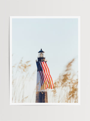 There she was, dancing in the sea breeze with the sea grass and shimmering in the late afternoon sun! Majestic American flag hanging from the Tybee Island Lighthouse in Tybee Island, GA. "Sweet Liberty" photographed by Kristen M. Brown, Samba to the Sea for The Sunset Shop.