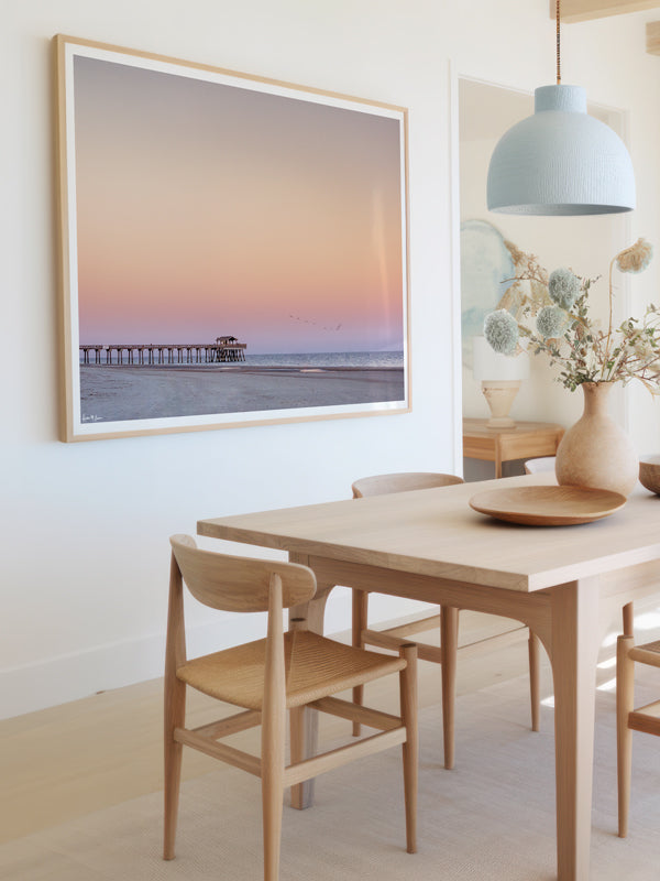 Coastal dining room with pastel sunset beach fine art print. Beautiful pastel pink sunset of Tybee Island Pier in Tybee Island, Georgia. Photographed by Samba to the Sea for The Sunset Shop.