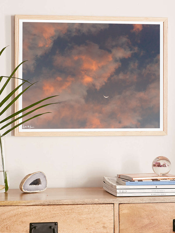 Crescent moon against a cotton candy pink sunrise sky in Savannah Georgia. To the Moon and Back II crescent moon print by Samba to the Sea at The Sunset Shop.