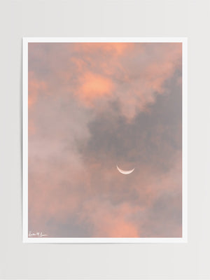Crescent moon against a cotton candy pink sunrise sky in Savannah Georgia. To the Moon and Back crescent moon print by Samba to the Sea at The Sunset Shop.