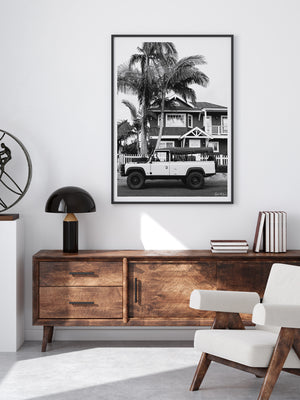 Black and white Land Rover wall art hanging in modern living room. "Beacon Rover" black and white Land Rover Defender Tdi Southern California photo print by Kristen M. Brown of Samba to the Sea for The Sunset Shop.