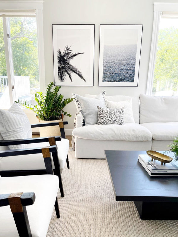Black and white palm tree photo print hanging neutral coastal tropical living room.  "Find Me Under the Palms" black and white palm tree print by Kristen M. Brown of Samba to the Sea for The Sunset Shop. Many thanks to Jenny from Palm and Prep for bringing home "Find Me Under the Palms" for her Black Rockn' Dream Home interior design project.