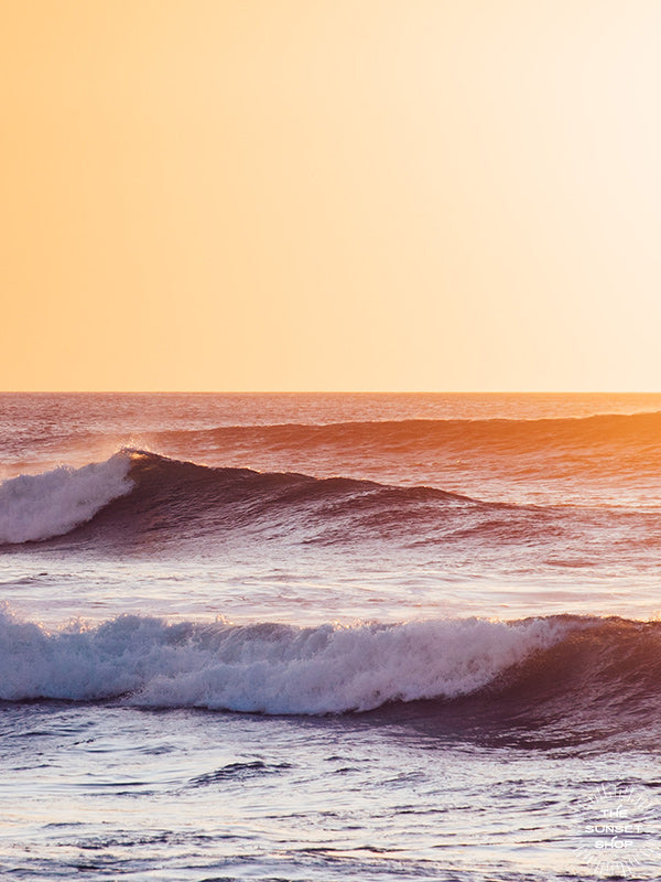 Golden sunset waves. Gone Surfing print by Samba to the Sea at The Sunset Shop. Image of breaking waves during a golden sunset in Costa Rica.