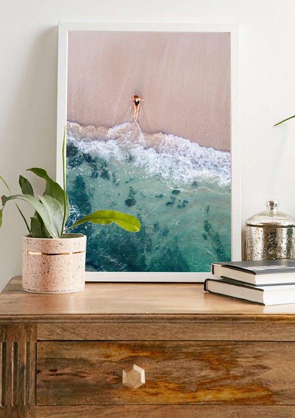 Wanderlust beach shelfie. Woman laying on the beach as the waves reach her feet in Costa Rica. Photographed by Samba to the Sea for The Sunset Shop.