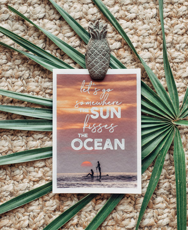 Let's go somewhere the sun kisses the ocean sunset wanderlust image by Samba to the Sea at The Sunset Shop.
