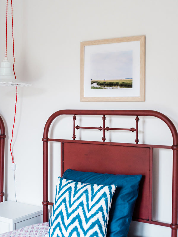 Majestic American flag waving in the breeze over the lowcountry marsh in Savannah, GA. “Lowcountry Liberty” photographed by Kristen M. Brown, Samba to the Sea for The Sunset Shop. Coastal Americana bedroom wall art.