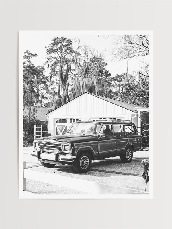 The Jeep that started an entire culture of Jeep lovers -- the Wagoneer! With its timeless design and power, this beauty is an instant transport back to simpler days where you really could easily get off the grid and off road sans cell phones and GPS. Welcome back that amazing family vacation roadtrip, all from the comfort of your smart home...wherever home may be with this B&W photo print "Lowcountry Wagoneer".