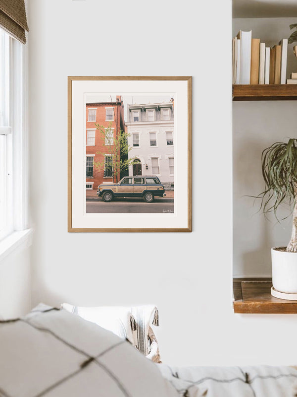 Classic car Jeep Wagoner framed photo print. With its timeless design and power, this beauty is an instant transport back to simpler days where you could easily get off the grid...or hop into the city from the 'burbs to see the Cherry Blossoms in full bloom in Washington DC! Welcome back to that amazing family weekend city adventure, all from the comfort of your smart home...wherever that smart home may be with this photo print "Old Town Wagoneer".