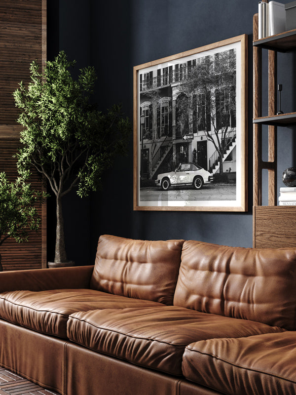 Vintage Porsche 911 parked in Savannah, GA black and white wall art in man cave library with dark walls and leather couch. Welcome back to your Savannah daydream, all from the comfort of your home...wherever home may be with this B&W photo print "One Way 911".