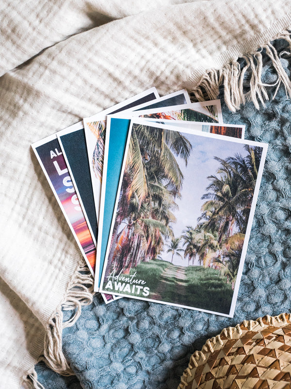 "Adventure Awaits" Costa Rica postcard. What's better than a text message from a loved one? Happy mail from a loved one! š«š Grab this dreamy set of five postcards printed on 100% recycled card stock and start sending (or leaving in their bag!) some happy mail postcards to your mom, boyfriend/wife/significant other, best friend...and of course your grandma! By Kristen M. Brown, Samba to the Sea for The Sunset Shop.