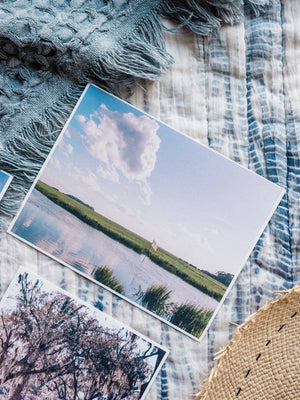 American flag waving on the marsh Savannah postcard. Printed on 100% recycled paper. Photographed by Savannah photographer Kristen M. Brown of Samba to the Sea for The Sunset Shop.