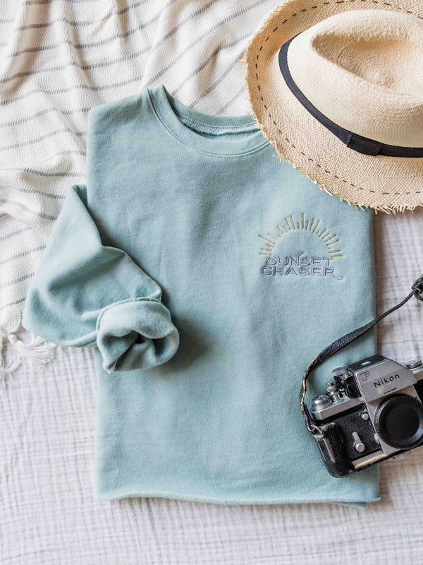 Calling all sunset chasers! There's nothing like ending the day watching the sun pass over horizon, painting the sky in magical colors...and now you can chase sunset while rocking this buttery soft, relaxed Sunset Chaser cropped sweatshirt! Embroidered with silver and gold thread, you won't want to take this cropped sweatshirt off — it's that stylish AND comfortable!!! Click here to check this sweatshirt off! Available at The Sunset Shop by Kristen M. Brown, Samba to the Sea. #sunsetchaser
