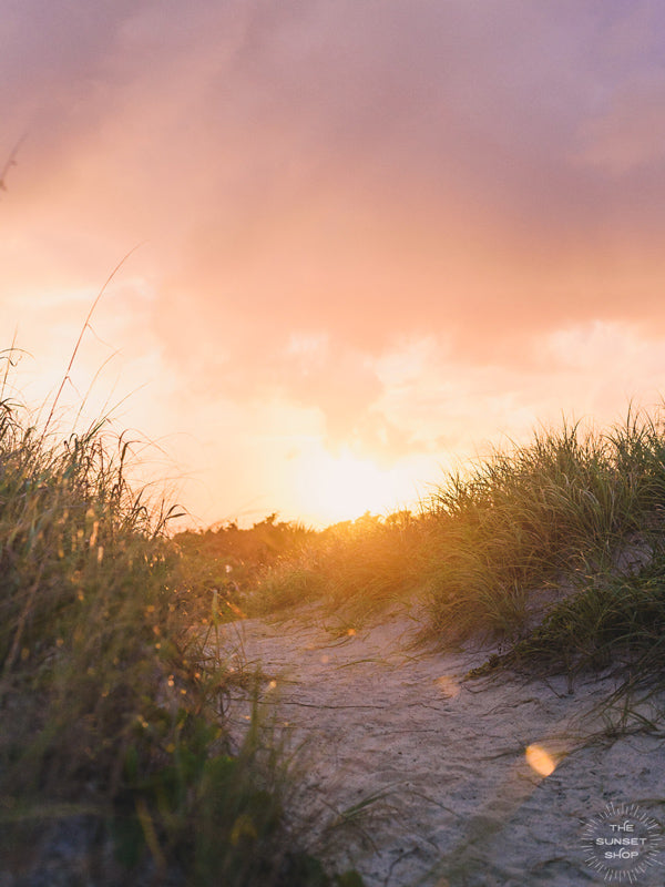 Magical sunset glow over the sand dunes in Sebastian Inlet State Park in Florida. Photographed by Kristen M. Brown of Samba to the Sea for The Sunset Shop.