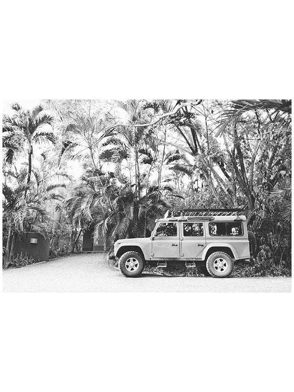 Because life is all about the magic in the detours and the beauty of taking time to explore bumpy, back road dirt roads in tropical paradise with Land Rover Defender just like this. "Tropical Sleigh" black and white Land Rover photo print photographed by Kristen M. Brown, Samba to the Sea for The Sunset Shop.