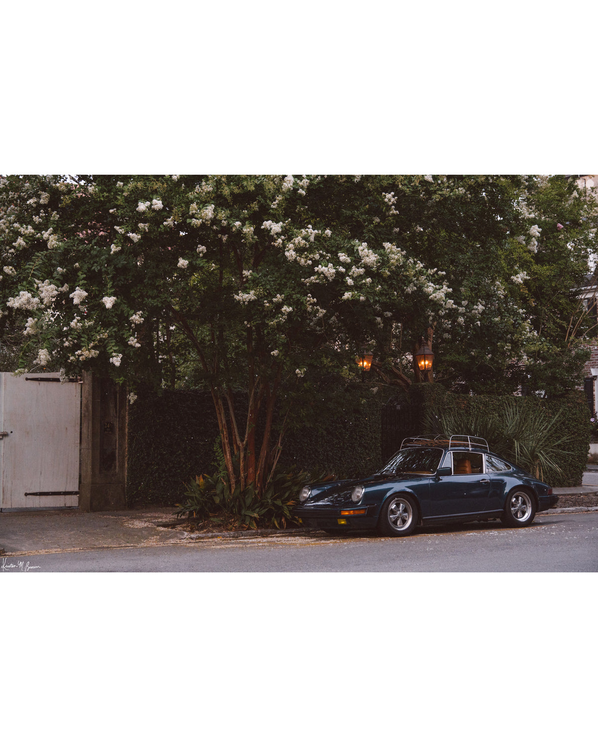 Tucked beneath the cascading white blooms of a towering crepe myrtle, this vintage Porsche 911 awaits its next adventure. So what are you waiting for? Hop on in and channel that carefree feeling of adventure and speed with this air cooled vintage beauty, "911 Meeting".  Vintage Porsche 911 photo print by Kristen M. Brown of Samba to the Sea for The Sunset Shop.