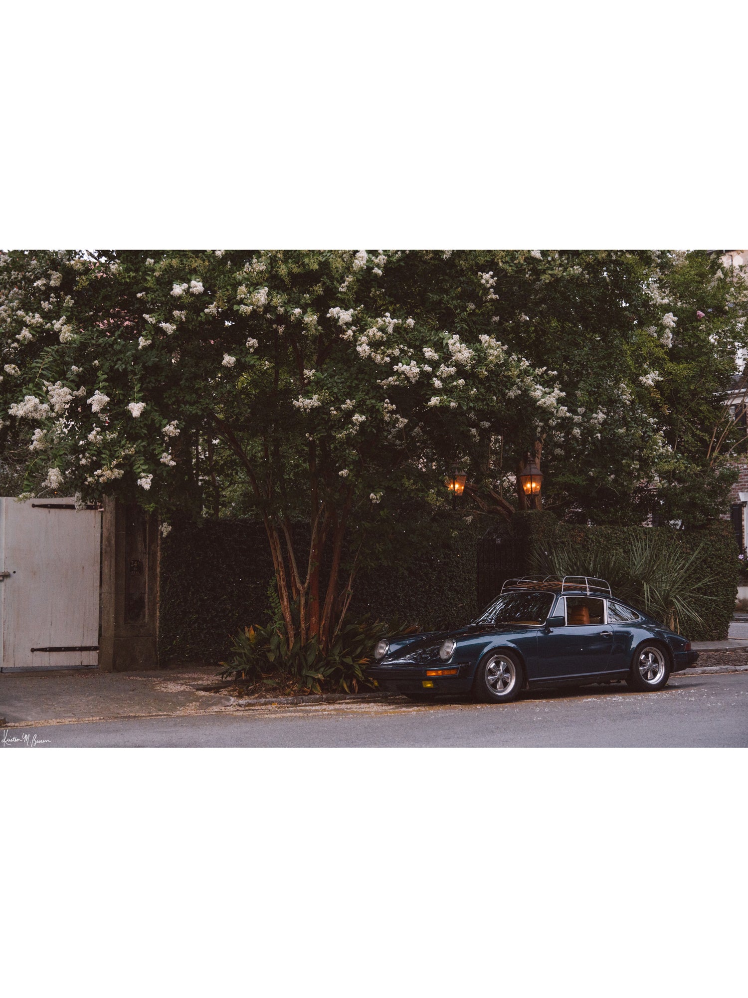 Tucked beneath the cascading white blooms of a towering crepe myrtle, this vintage Porsche 911 awaits its next adventure. So what are you waiting for? Hop on in and channel that carefree feeling of adventure and speed with this air cooled vintage beauty, "911 Meeting".  Vintage Porsche 911 photo print by Kristen M. Brown of Samba to the Sea for The Sunset Shop.
