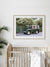 Step on into a whimsical world of adventure with framed fine art print "Africa Awaits" for your nursery artwork! Featuring a classic green Land Rover Series three playfully adorned with blow up safari animals backdropped by fragrantly blooming Star Jasmine, this fine art photograph celebrates the spirit of exploration and childhood wonder. Photo print by Kristen M. Brown of Samba to the Sea for The Sunset Shop.