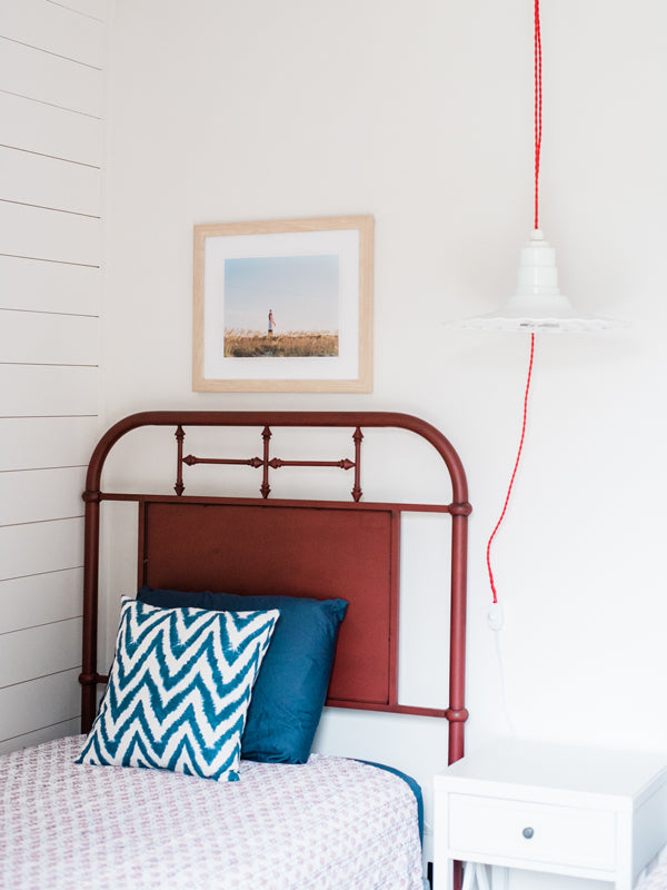 Majestic American flag hanging from the Tybee Island Lighthouse in Tybee Island, GA. “Amber Waves” photographed by Kristen M. Brown, Samba to the Sea for The Sunset Shop. Coastal Americana bedroom wall art.
