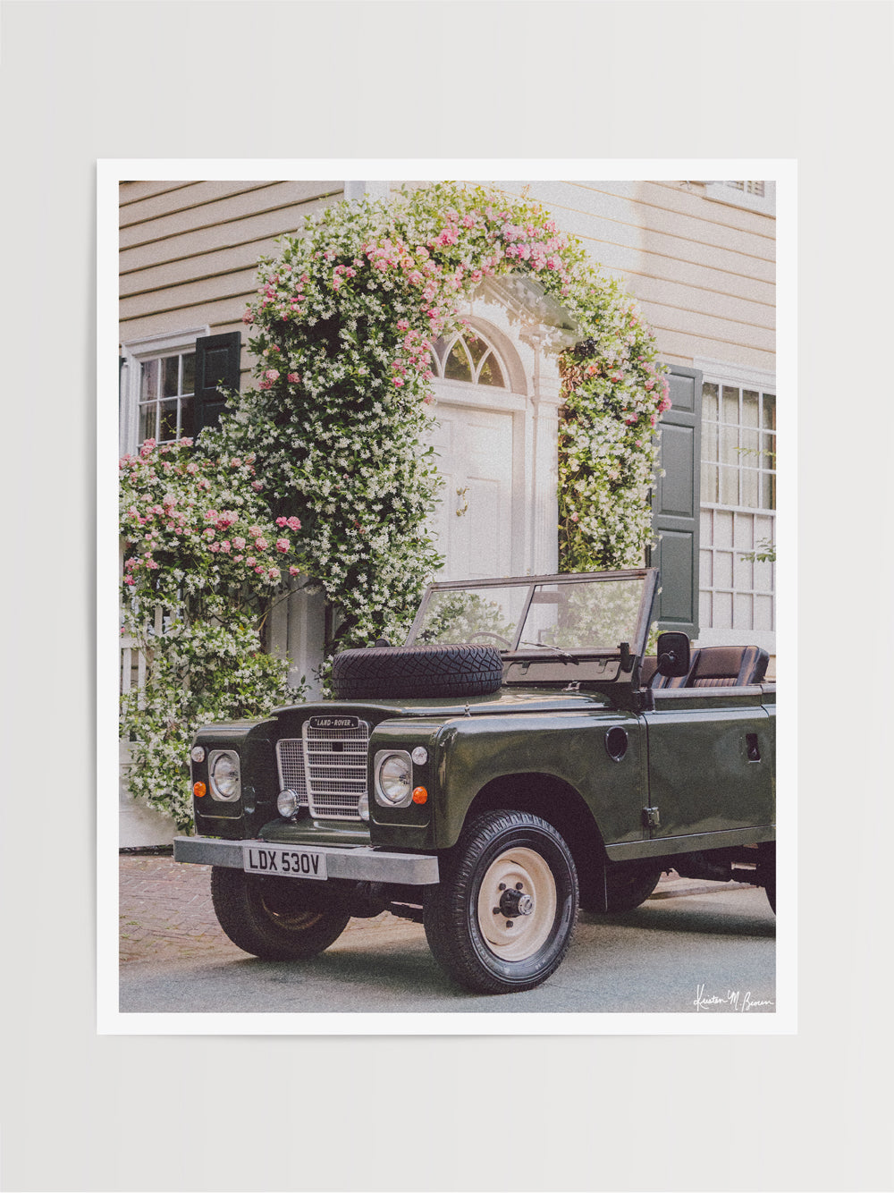 There&#39;s nothing like Charleston in the springtime, especially when the Star Jasmine is in bloom! Hop on in and cruise the intoxicating Jasmine scented streets of Charleston in this beautiful Land Rover Series three truck! &quot;Blooming Rover&quot; is a journey into the timeless streets of the South, where adventure and nostalgia meet. Photo print by Kristen M. Brown of Samba to the Sea for The Sunset Shop.