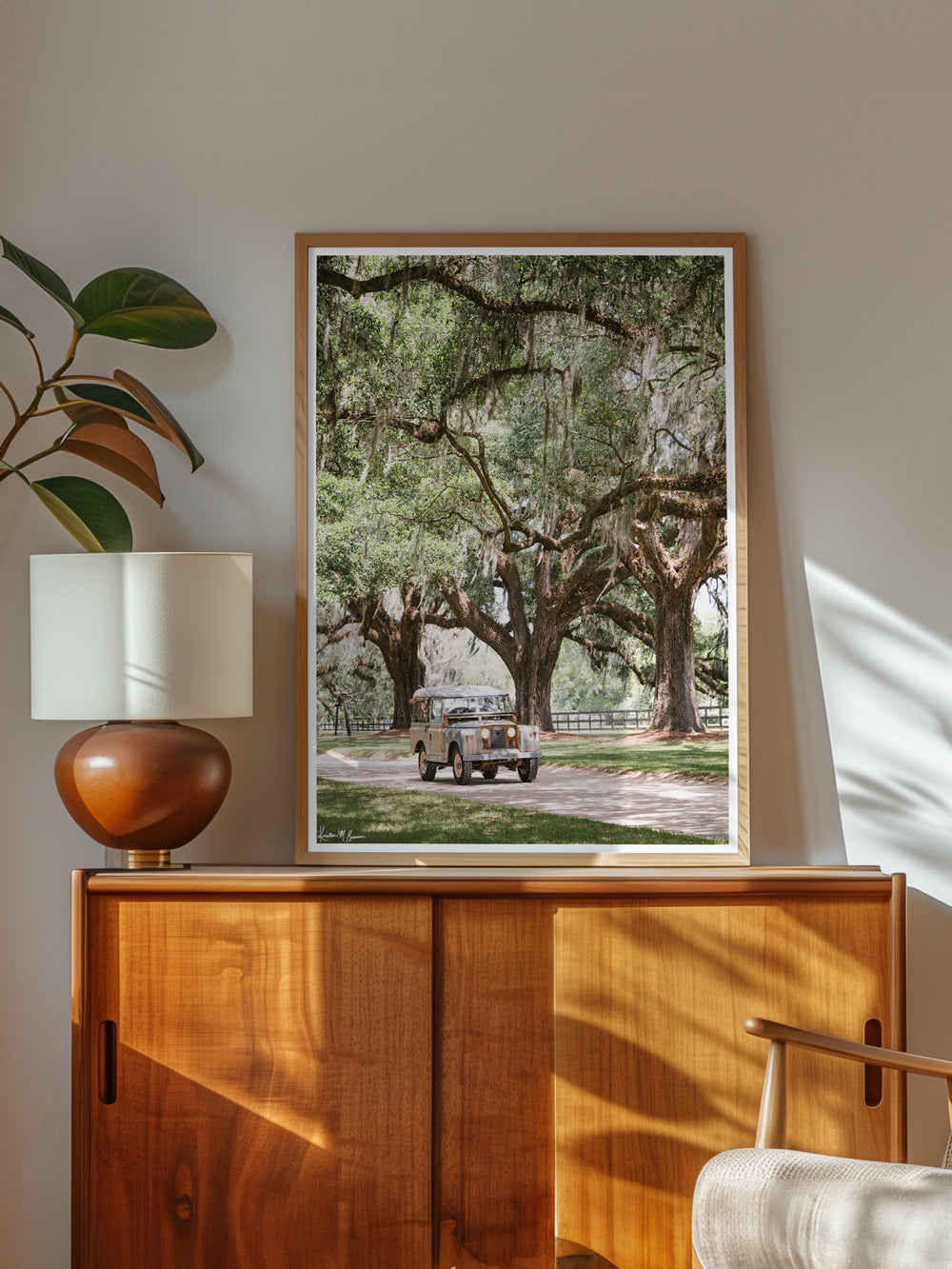 Land Rover photography for your living room. It's a gorgeous spring day, your dog is riding shotgun, and your out for a ride, cruising under majestic Live Oak trees dripping with Spanish moss in your classic Land Rover Series ii. Yes, these are days you live for. Land Rover Series ii in Charleston photo print by Kristen M. Brown of Samba to the Sea for The Sunset Shop.