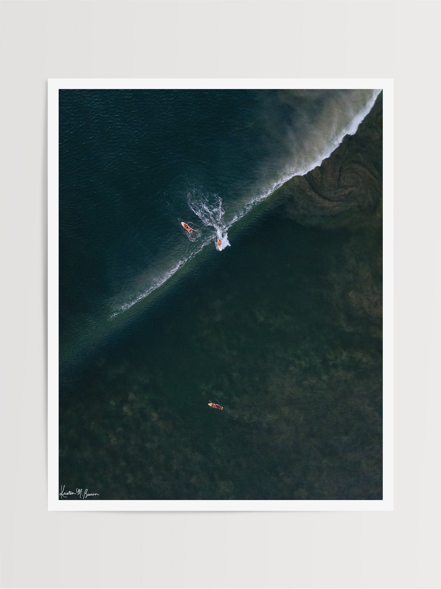 Aerial surfer print by Samba to the Sea at The Sunset Shop. Image is an aerial photo of surfer dropping in on a wave in Tamarindo, Costa Rica.