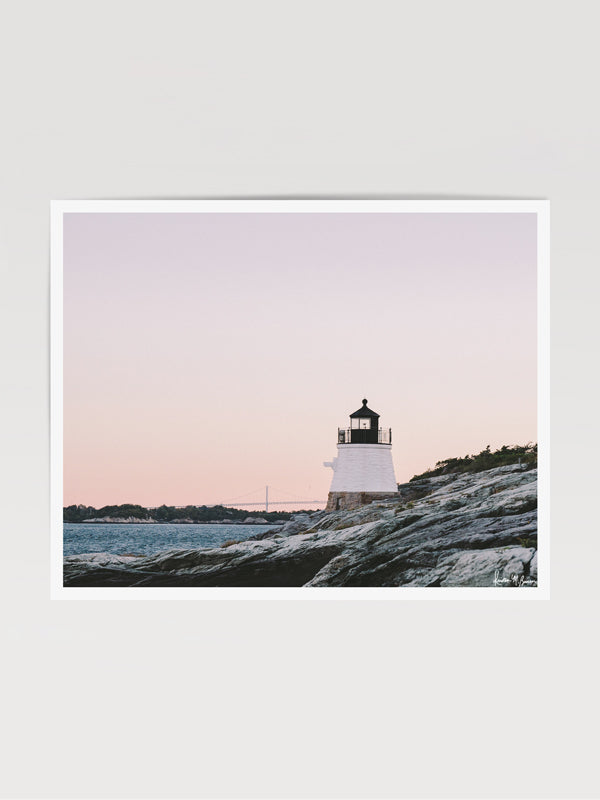 "Castle Hill en Rosé" photo print of the Castle Hill lighthouse in Newport, Rhode Island with a dreamy pastel pink sunrise sky and the Clairborne Pell Newport Bridge in the background. Photographed by Kristen M. Brown of Samba to the Sea for The Sunset Shop.