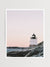 "Castle Hill en Rosé" photo print of the Castle Hill lighthouse in Newport, Rhode Island with a dreamy pastel pink sunrise sky and the Clairborne Pell Newport Bridge in the background. Photographed by Kristen M. Brown of Samba to the Sea for The Sunset Shop.