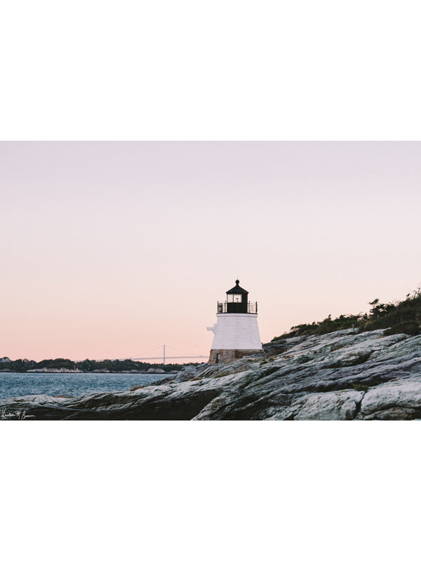 "Castle Hill en Rosé" photo print of the Castle Hill lighthouse in Newport, Rhode Island with a dreamy pastel pink sunrise sky and the Clairborne Pell Newport Bridge in the background. Photographed by Kristen M. Brown of Samba to the Sea for The Sunset Shop.