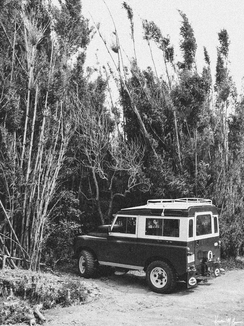 Tucked away in between volcanoes, there lies a magical cloud forest called Monteverde in Costa Rica. So what are you waiting for? Hop on in to this vintage Land Rover and we'll adventure away down dirt mountain roads to find that secret waterfall you've been dreaming of! "Cloud Forest Rover" black and white Land Rover series 3 photo print by Kristen M. Brown of Samba to the Sea for The Sunset Shop.