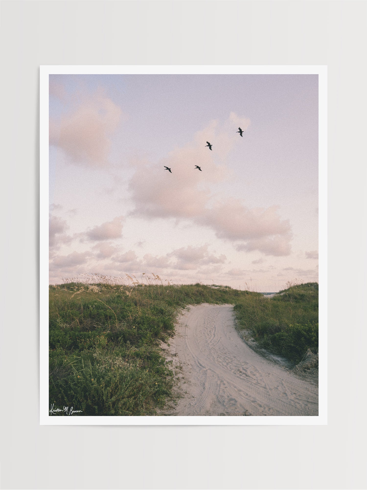 Bring home that feeling of the warm ocean breeze flowing through your hair, the soft pastel evening light, and the gentle, timeless magic of the shoreline at day's end with "Cloud Patrol". Sunset beach photo print with soaring pelicans in Charleston, SC by Kristen M. Brown of Samba to the Sea for The Sunset Shop.