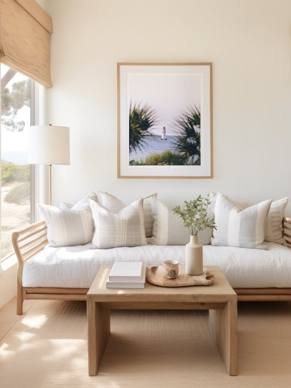 She's that beacon, the first thing you see as you cross over the bridge to Tybee Island. And she's the last thing on Tybee you say goodbye to once you're headed home from your summer beach vacation. She evokes all those feelings of Lowcountry coastal living. She is the petite Cockspur Lighthouse. ⠀ Cockspur Lighthouse during golden hour on Tybee Island, GA. "Cockspur" photographed by Kristen M. Brown of Samba to the Sea for The Sunset Shop.
