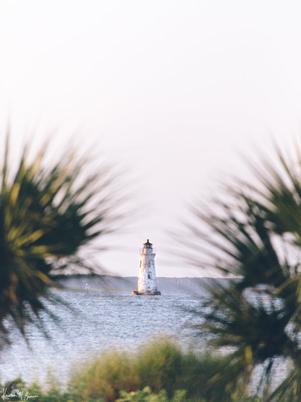 She&#39;s that beacon, the first thing you see as you cross over the bridge to Tybee Island. And she&#39;s the last thing on Tybee you say goodbye to once you&#39;re headed home from your summer beach vacation. She evokes all those feelings of Lowcountry coastal living. She is the petite Cockspur Lighthouse. ⠀ Cockspur Lighthouse during golden hour on Tybee Island, GA. &quot;Cockspur&quot; photographed by Kristen M. Brown of Samba to the Sea for The Sunset Shop.