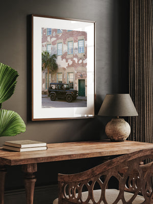 Charleston Land Rover photography print hanging above desk.  "Dock D90" photo print of Land Rover Defender 90 in historic downtown Charleston, SC. Photographed by Kristen M. Brown of Samba to the Sea for The Sunset Shop.