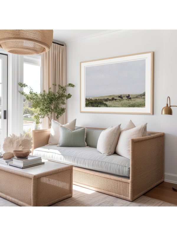 "Dune Ride" photo print of equestrians riding their horses through the beach dunes in coastal New England framed print hanging in serene coastal living room. Photographed by Kristen M. Brown of Samba to the Sea for The Sunset Shop.