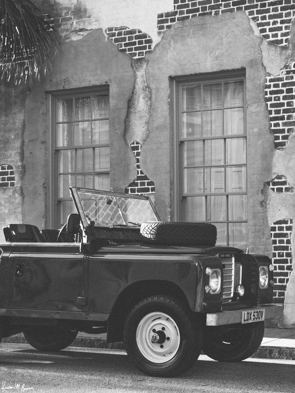 Black and white classic Land Rover photography for your home! From the moment you step foot in Charleston, you're instantly transported back to another time and place. And if you're going to transport back, why not go in style with this classic Land Rover Series three truck? Hop on in, the top is off and this Rover is waiting for you! Photo print by Kristen M. Brown of Samba to the Sea for The Sunset Shop.