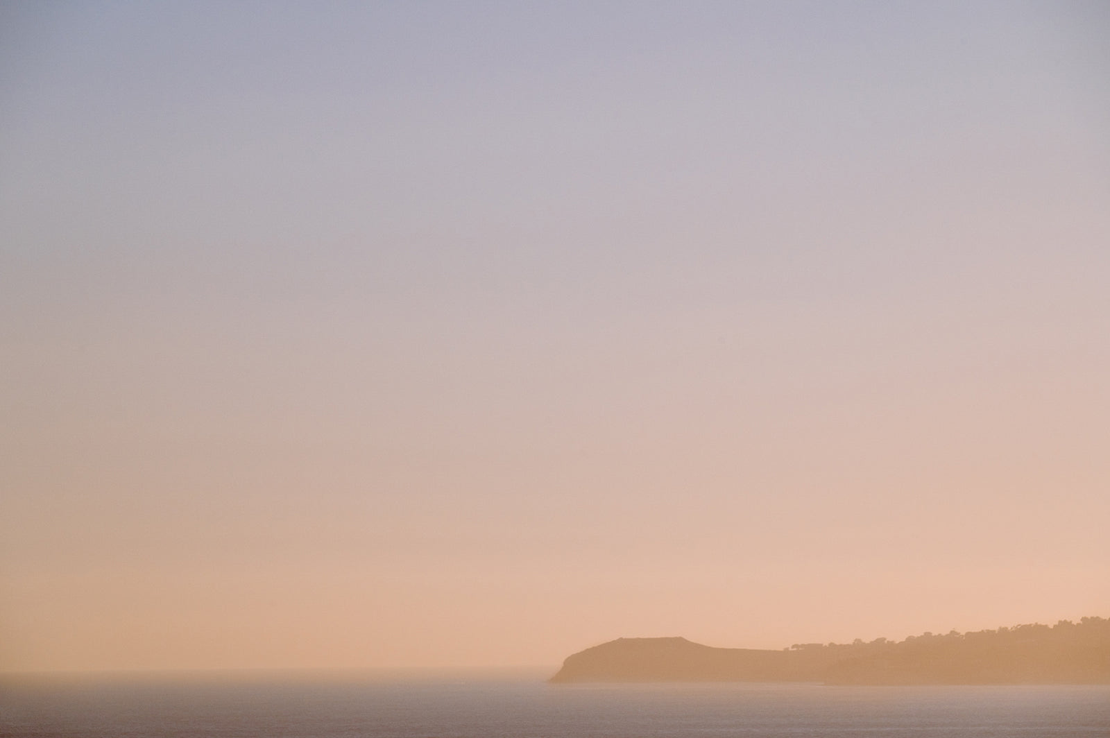 Golden sunset in Malibu, California over Point Dume. Photographed by Kristen M. Brown of Samba to the Sea.